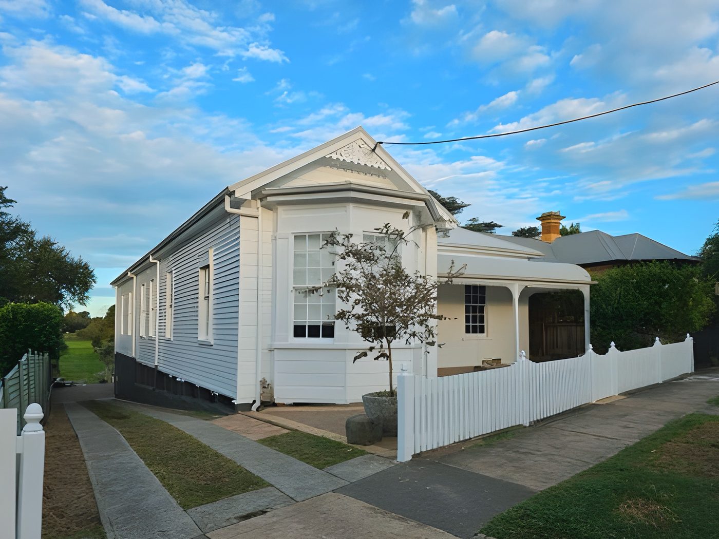 After: The same Federation cottage after its full exterior restoration in white and cream
