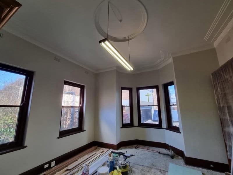 After: The same heritage room after its walls, ceiling and cornices were restored and painted