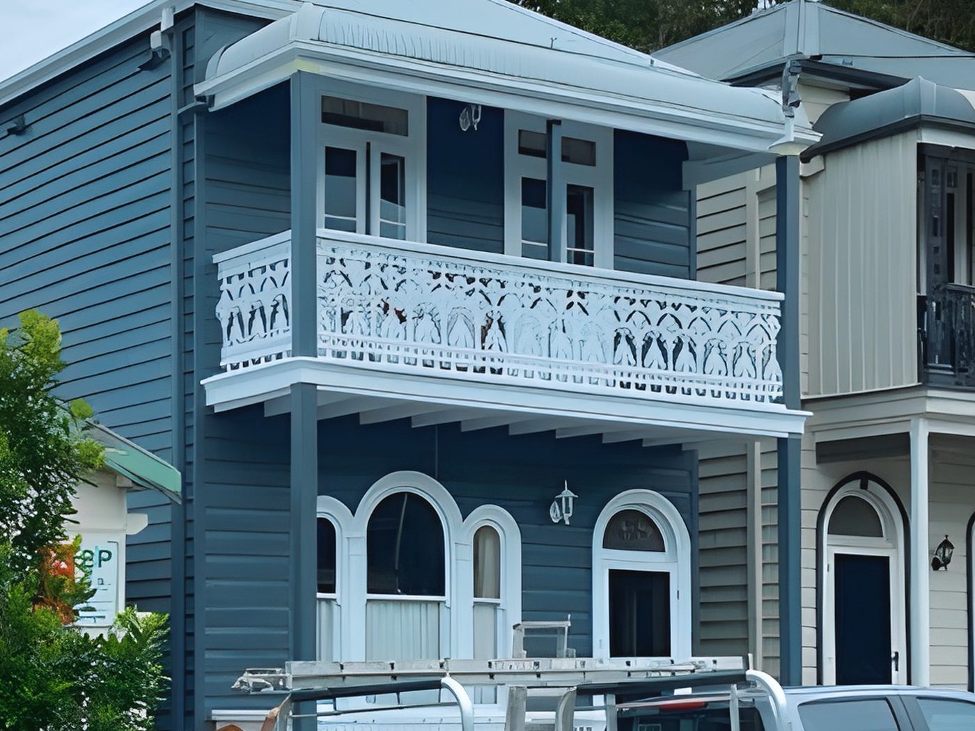 After: The same terrace after its repaint in deep blue with white lace and trims
