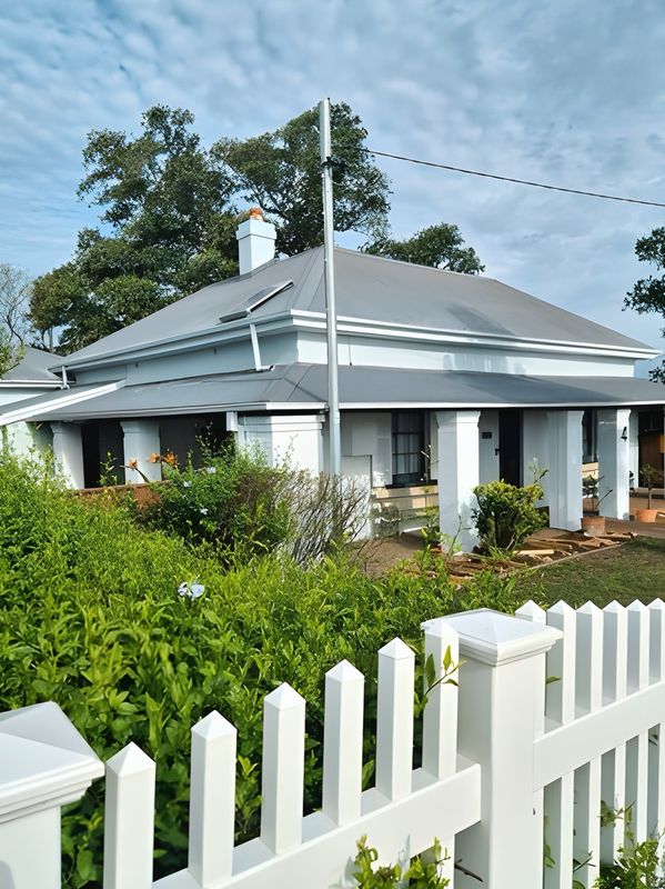 Cottage behind a picket fence by Andrew Lindner Painting, Newcastle painters