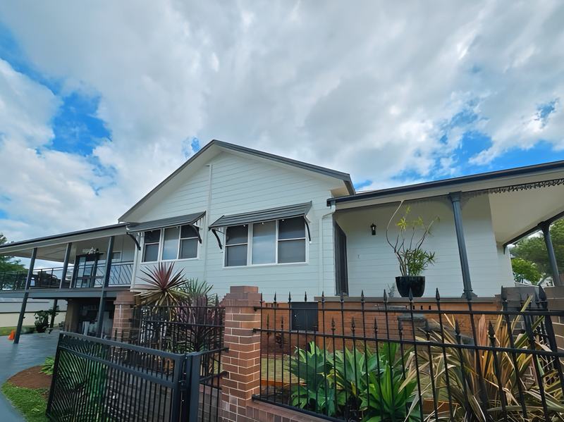 Raised weatherboard home by Andrew Lindner Painting
